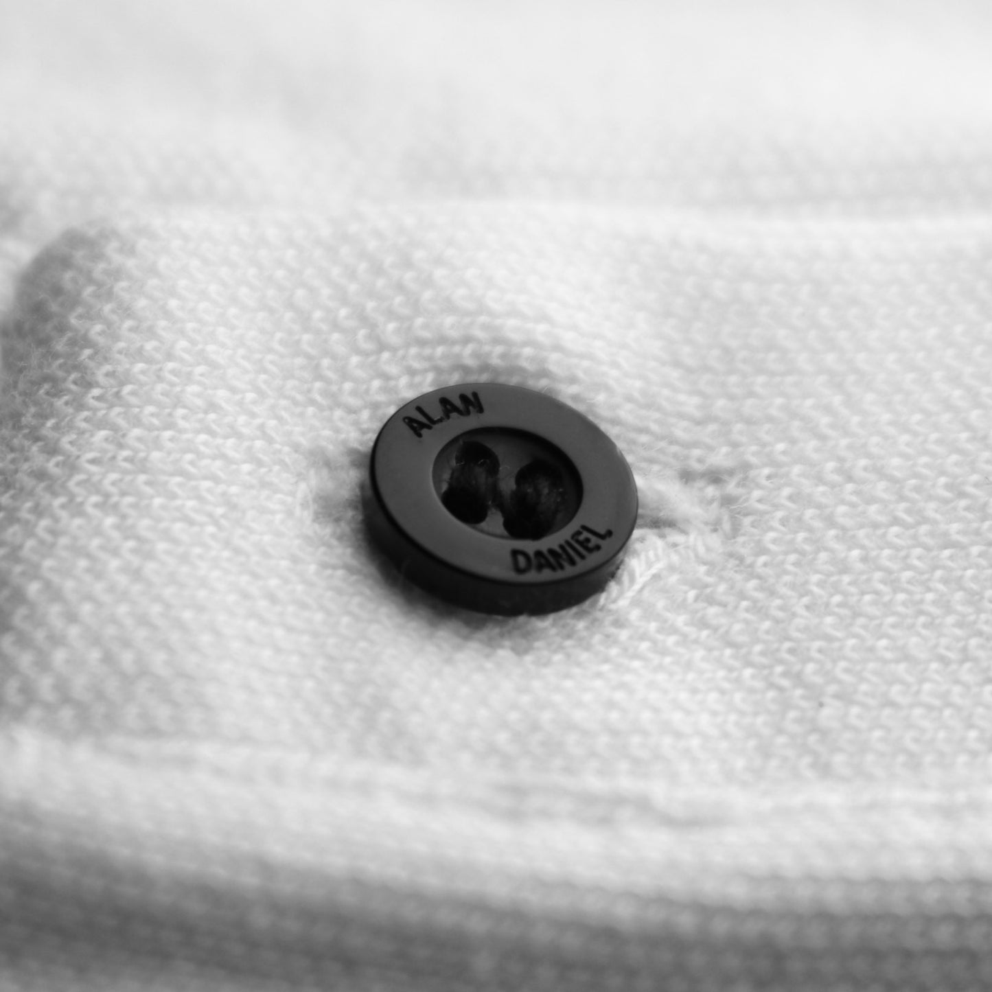 Alan Daniel engraved button meso polo